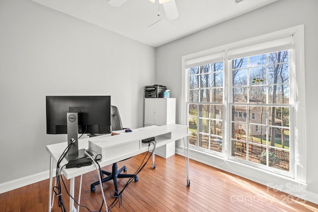 office space with ceiling fan, baseboards, and wood finished floors