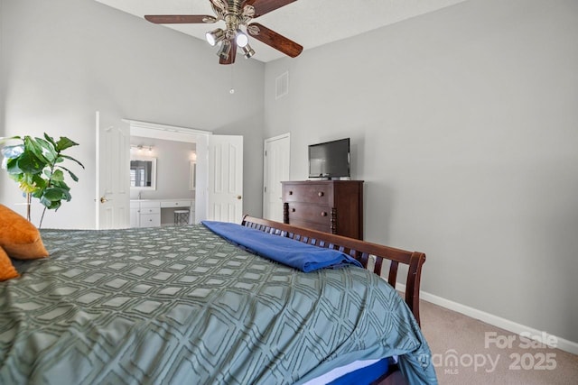 carpeted bedroom featuring baseboards, visible vents, a ceiling fan, ensuite bath, and high vaulted ceiling