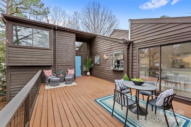 wooden deck with outdoor dining area