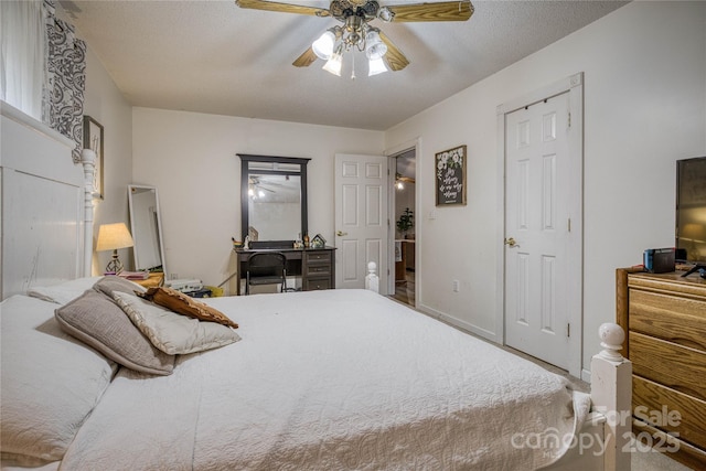 bedroom featuring ceiling fan, a textured ceiling, and baseboards