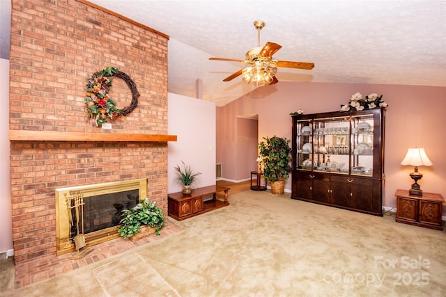 living room featuring a textured ceiling, carpet floors, lofted ceiling, a brick fireplace, and ceiling fan