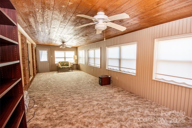 interior space featuring a ceiling fan and wood ceiling