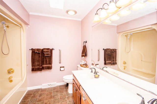 bathroom featuring vanity, crown molding, toilet, and visible vents