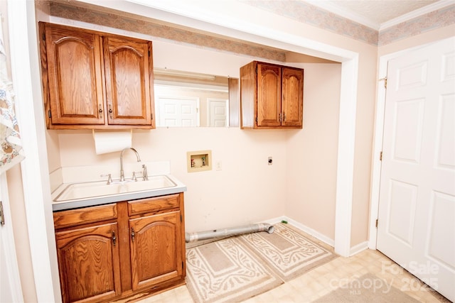 washroom with hookup for a washing machine, baseboards, cabinet space, a sink, and electric dryer hookup