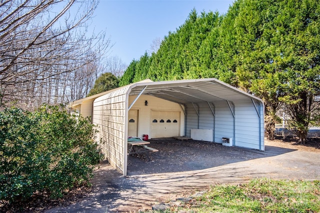 exterior space featuring a carport and a garage