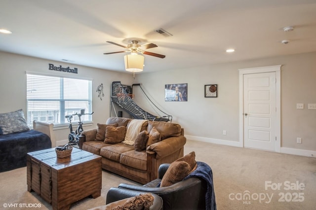 living room featuring recessed lighting, light colored carpet, visible vents, ceiling fan, and baseboards