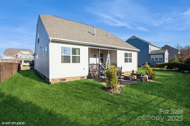 back of property with a patio, fence, a yard, crawl space, and roof with shingles