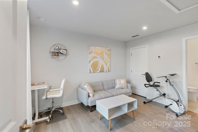 living room with visible vents, recessed lighting, wood finished floors, and baseboards