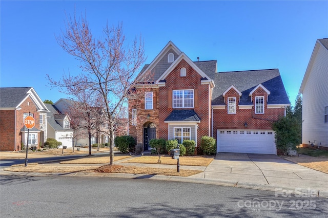 view of front of house featuring brick siding, an attached garage, concrete driveway, and roof with shingles