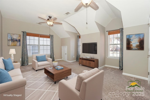 living area with light colored carpet, baseboards, lofted ceiling, and a ceiling fan