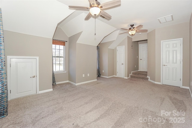 bonus room featuring visible vents, baseboards, carpet, and vaulted ceiling