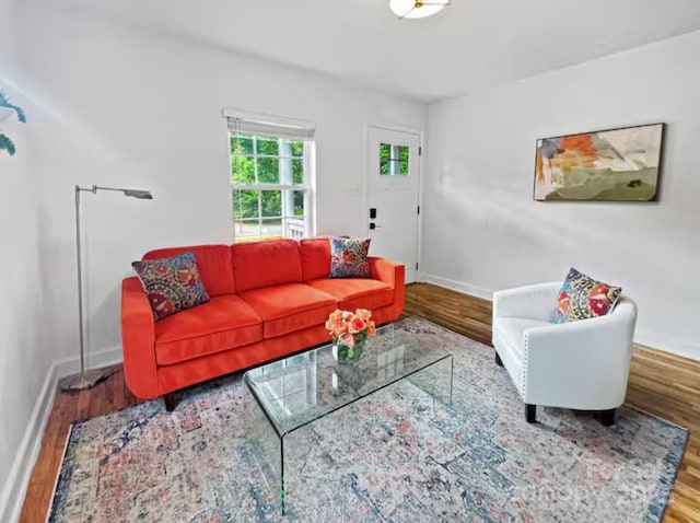 living room with wood finished floors and baseboards