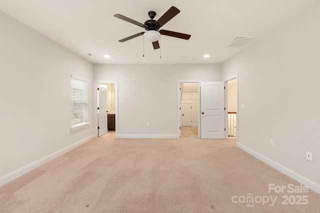 unfurnished bedroom with light carpet, baseboards, visible vents, and recessed lighting