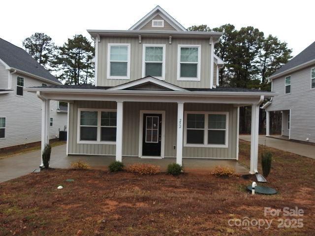 view of front of house featuring covered porch and board and batten siding