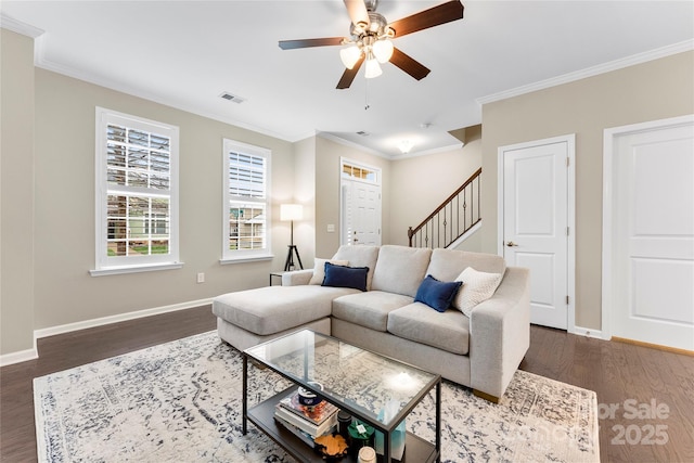 living room with crown molding, stairway, dark wood-style flooring, and baseboards