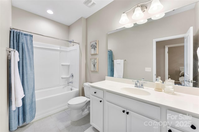 full bathroom with visible vents, toilet, shower / bath combo, vanity, and tile patterned flooring