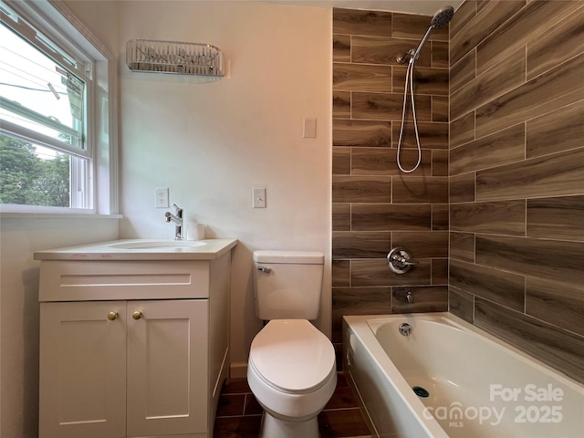 full bath featuring toilet, washtub / shower combination, and vanity