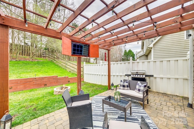 view of patio / terrace with a fenced backyard, a pergola, area for grilling, and an outdoor living space with a fire pit