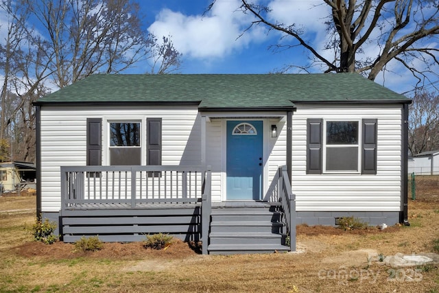 bungalow-style house with crawl space and roof with shingles