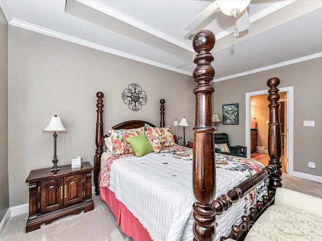 bedroom featuring light carpet, baseboards, a raised ceiling, and ornamental molding