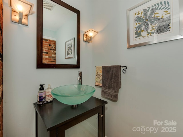 bathroom with visible vents and vanity