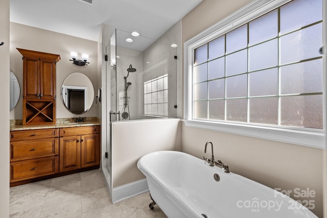 bathroom featuring a freestanding bath, a tile shower, vanity, and recessed lighting