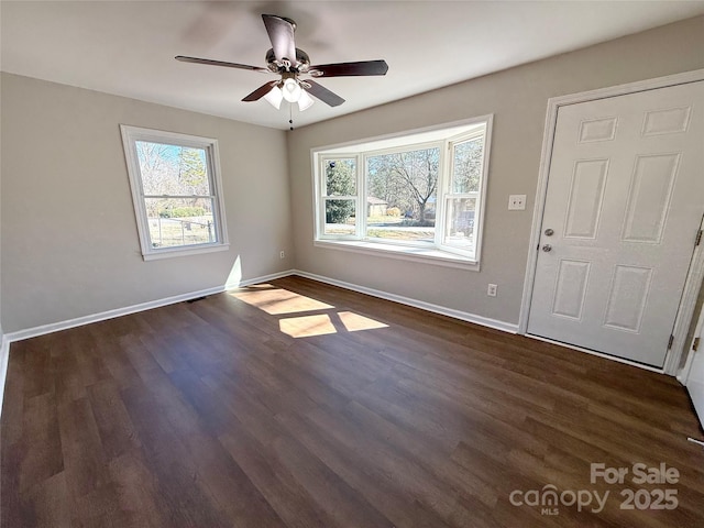 foyer entrance with a ceiling fan, dark wood-style flooring, visible vents, and baseboards