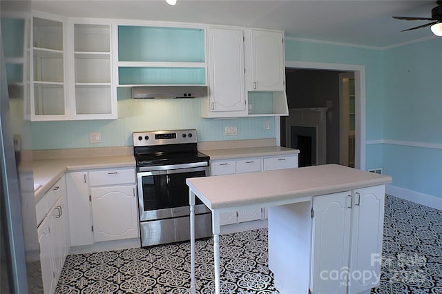 kitchen with stainless steel electric range, crown molding, wall chimney range hood, white cabinetry, and open shelves