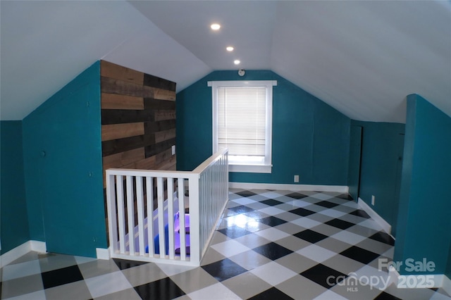 bonus room with recessed lighting, lofted ceiling, wood walls, baseboards, and tile patterned floors