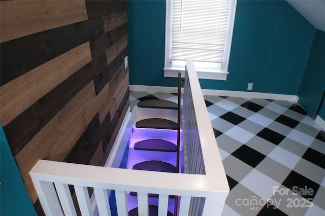 interior space with baseboards and tile patterned floors