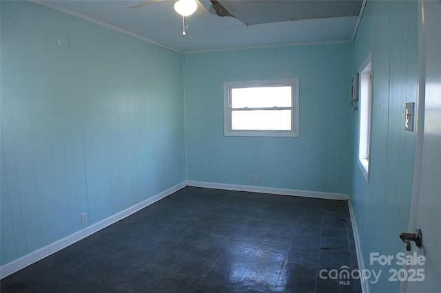 unfurnished room featuring ornamental molding, dark floors, baseboards, and a ceiling fan