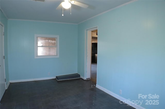 spare room featuring baseboards, a ceiling fan, and crown molding