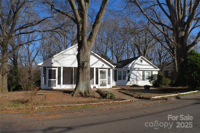 view of front facade featuring a sunroom