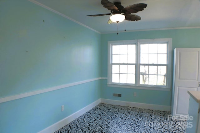 interior space with a healthy amount of sunlight, visible vents, crown molding, and baseboards