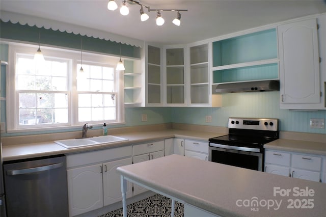 kitchen with open shelves, stainless steel appliances, white cabinets, a sink, and extractor fan