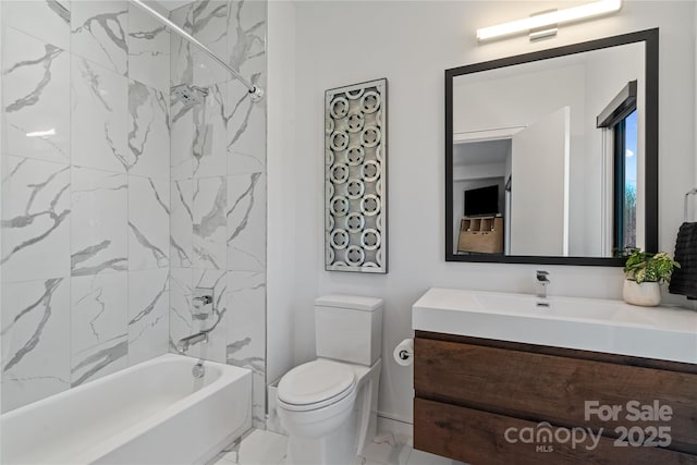 bathroom with tub / shower combination, vanity, and toilet