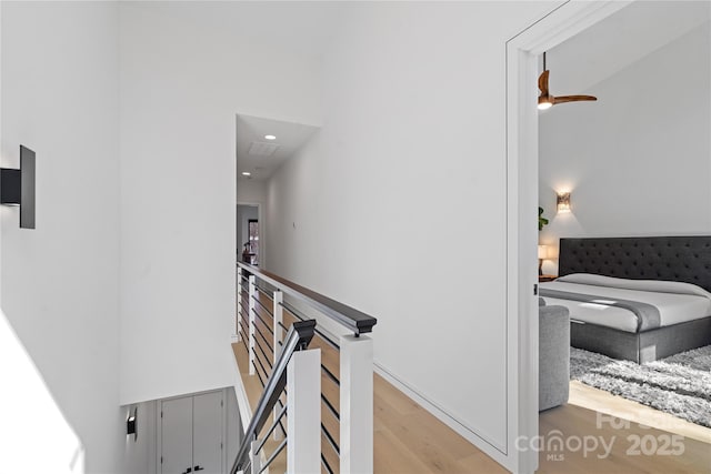 stairway featuring wood finished floors