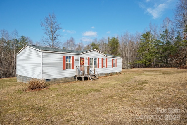 view of front facade with a front yard and crawl space