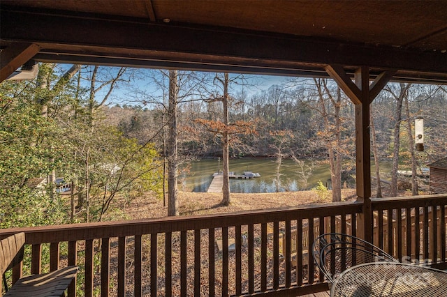 wooden deck featuring a water view