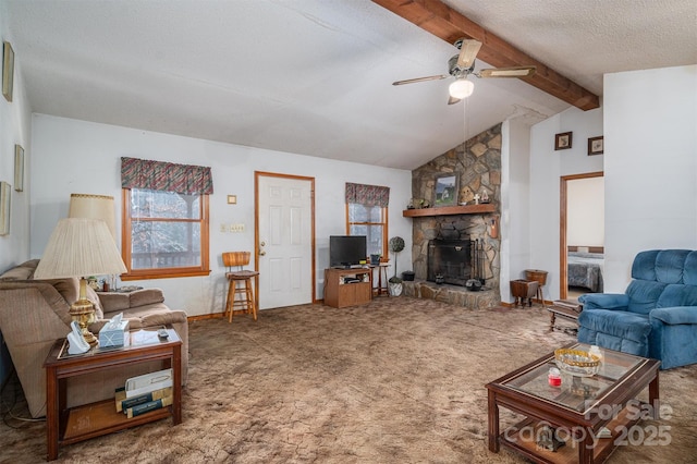 carpeted living room featuring lofted ceiling with beams, ceiling fan, a textured ceiling, and a fireplace