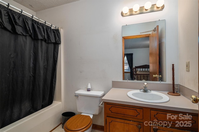 full bath featuring a textured ceiling, vanity, toilet, and shower / bathtub combination with curtain