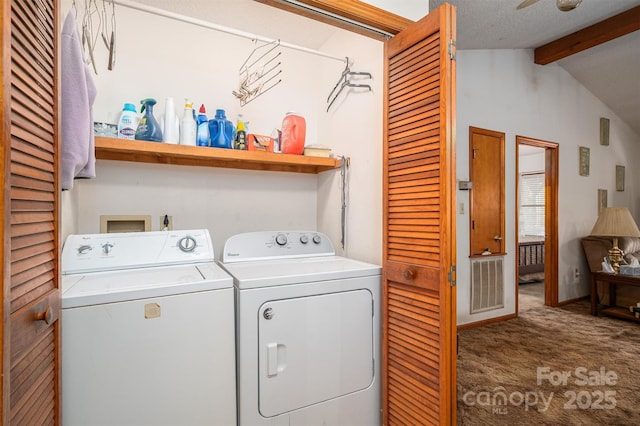 washroom with visible vents, carpet flooring, a textured ceiling, separate washer and dryer, and laundry area