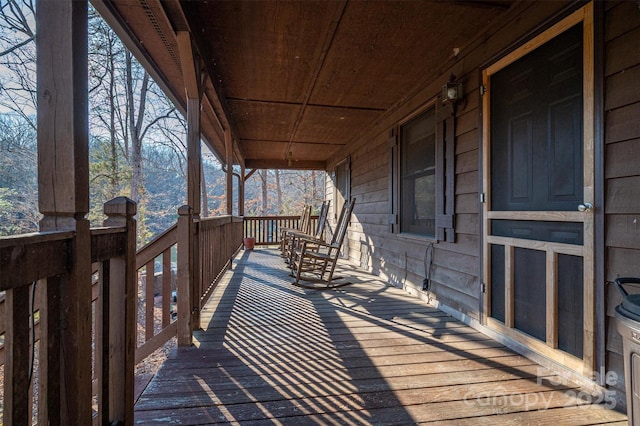 wooden deck featuring covered porch