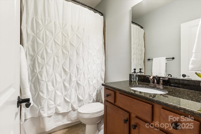 full bath featuring toilet, tile patterned flooring, shower / bath combination with curtain, and vanity