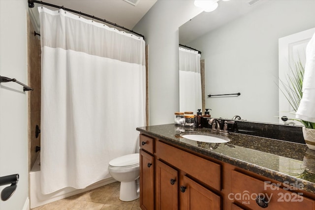 bathroom featuring toilet, shower / bath combo, vanity, and tile patterned floors