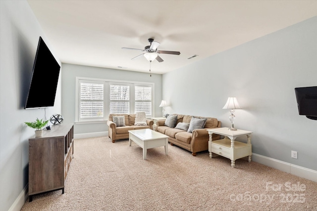 living area featuring light carpet, ceiling fan, visible vents, and baseboards