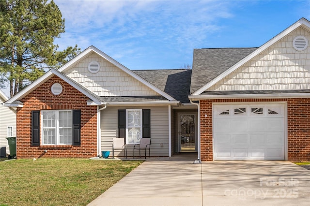 view of front of house featuring an attached garage, brick siding, concrete driveway, roof with shingles, and a front lawn