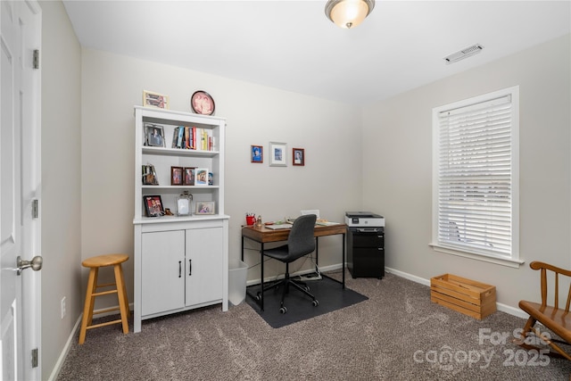 home office with baseboards, visible vents, and dark carpet