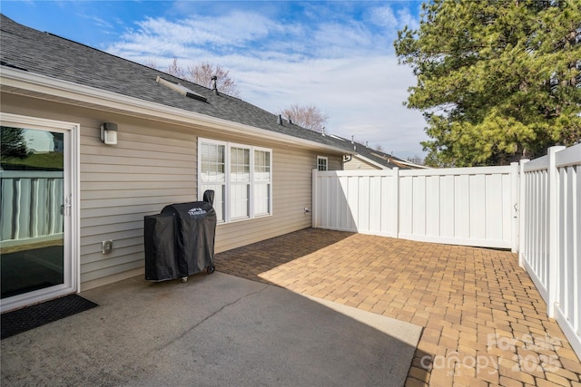 view of patio / terrace featuring area for grilling and fence