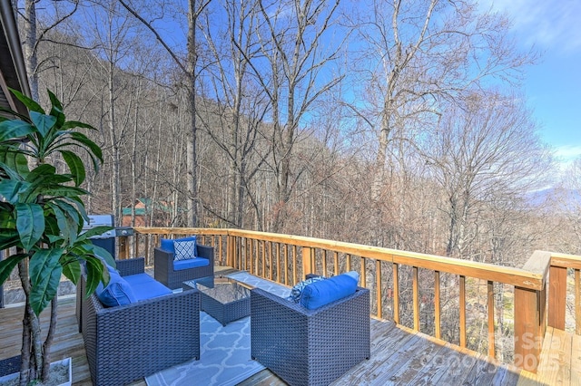 wooden deck featuring outdoor lounge area